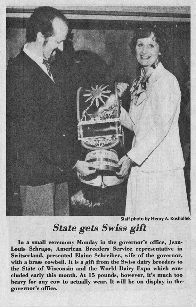 State gets Swiss gift In a small ceremony Monday in the governor’s office, Jean-louis Schrago, American Breeders Service representative in Switzerland, presented Elaine Schreiber, wife of the governor, with a brass cowbell. It is a gift from the Swiss dairy breeders to the State of Wisconsin and the World Dairy Expo which concluded early this month. At 15 pounds, however, it’s much too heavy for any cow to actually wear. It will be on display in the governor’s office. Staff photo by Henry A. Koshollek